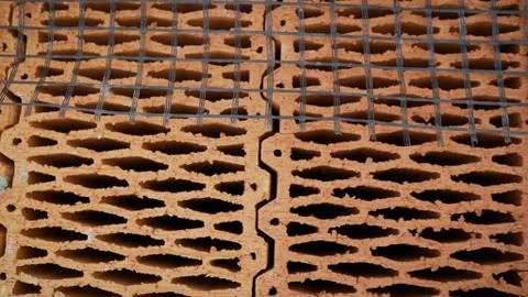 Ceramic building blocks stacked in a row. Ceramic blocks are in a row. Buildi Stockfoto's