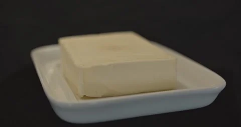 Ceramic butter dish on black background Stock Footage 130737632