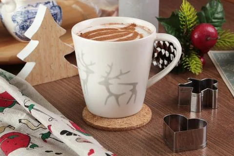 Ceramic cappuccino cup and table decor. Christmas festivities. Background for Stock Photos