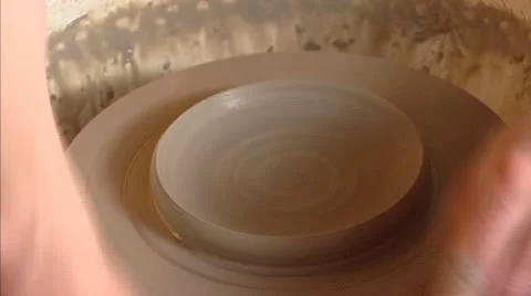 Ceramic clay on turntable - shaping and finishing a bowl Stock Footage 21272495