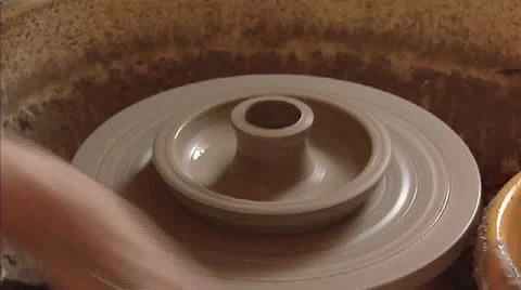 Ceramic clay on turntable - shaping and finishing a candlestick Stock Footage 21272559