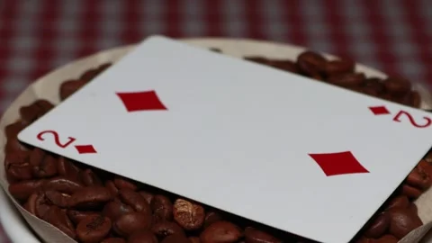 The ceramic coffee brewing the core coffees inside and the playing cards Stock Footage 253815467
