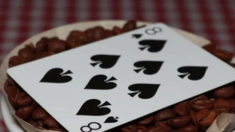 The ceramic coffee brewing the core coffees inside and the playing cards Stock Footage 253815691