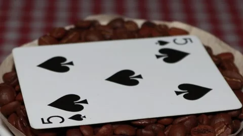 The ceramic coffee brewing the core coffees inside and the playing cards Stock Footage 253815792