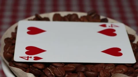 The ceramic coffee brewing the core coffees inside and the playing cards Stock Footage 253816382
