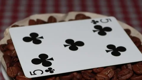 The ceramic coffee brewing the core coffees inside and the playing cards Stock Footage 253816458