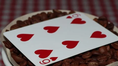 The ceramic coffee brewing the core coffees inside and the playing cards Stock Footage 253816496