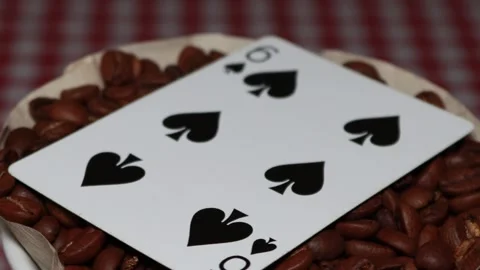 The ceramic coffee brewing the core coffees inside and the playing cards Stock Footage 253816708