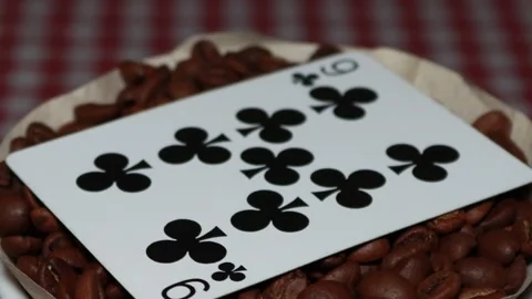 The ceramic coffee brewing the core coffees inside and the playing cards Stock Footage 253817100