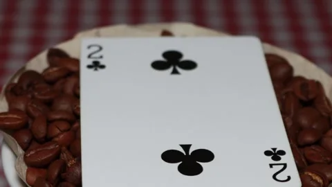 The ceramic coffee brewing the core coffees inside and the playing cards Stock Footage 253817196