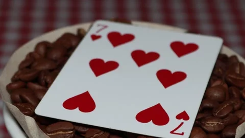 The ceramic coffee brewing the core coffees inside and the playing cards Stock Footage 253817459