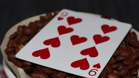 The ceramic coffee brewing the core coffees inside and the playing cards Stock Footage 253817526