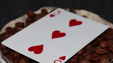 The ceramic coffee brewing the core coffees inside and the playing cards Stock Footage 253817545