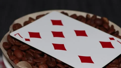 The ceramic coffee brewing the core coffees inside and the playing cards Stock Footage 253817683