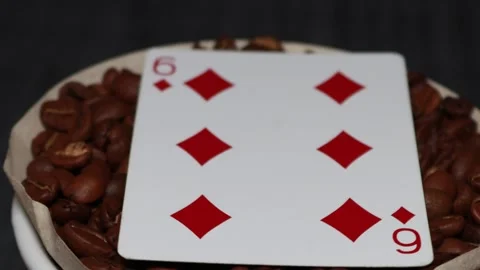 The ceramic coffee brewing the core coffees inside and the playing cards Stock Footage 253817705