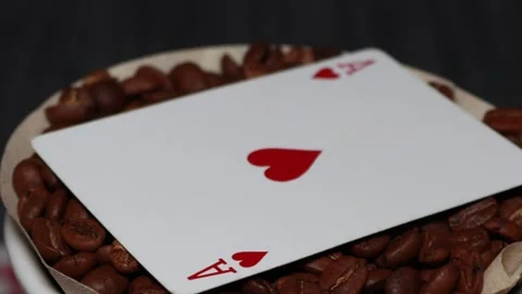 The ceramic coffee brewing the core coffees inside and the playing cards Stock Footage 253817816