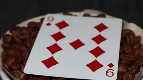 The ceramic coffee brewing the core coffees inside and the playing cards Stock Footage 253817848