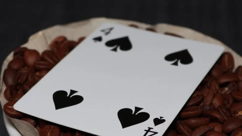 The ceramic coffee brewing the core coffees inside and the playing cards Stock Footage 253818043