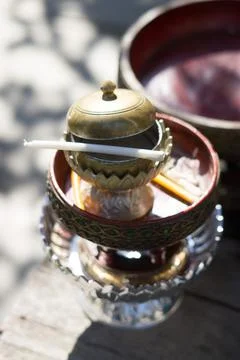 Ceramic cup and holy thread with holy water's Fotos Stock