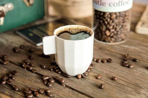 A ceramic cup of black coffee on a rustic wooden table top Stock Photos