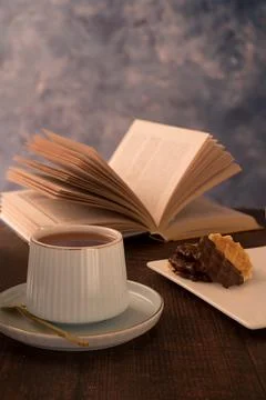 Ceramic cup of black tea and book reading time Stock Photos