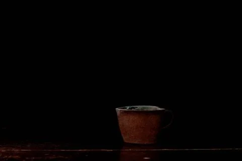 Ceramic cup with a dark background. Stock Photos