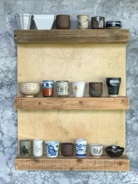 Ceramic cup hang on wall Stock Photos