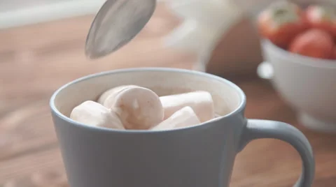 Ceramic cup of hot brown cacao stands on wooden table Stock Footage 68954632