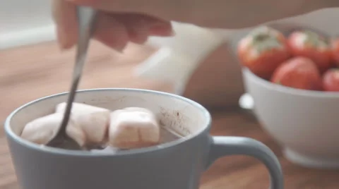 Ceramic cup of hot brown cacao stands on wooden table Stock Footage 68954754
