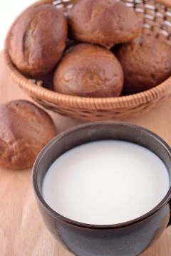 Ceramic cup with milk and bread Stock Photos