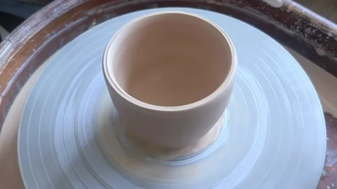 Ceramic cup on on pottery wheel, Close up, top view. Stock Footage 293143607