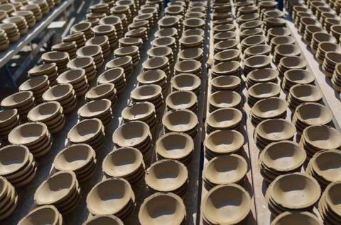 Ceramic cup in rack prepare for bring in furnace in factory Stock Photos