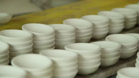 Ceramic cup in rack prepare for painting design on surface in pottery workshop. Video stock 194532142
