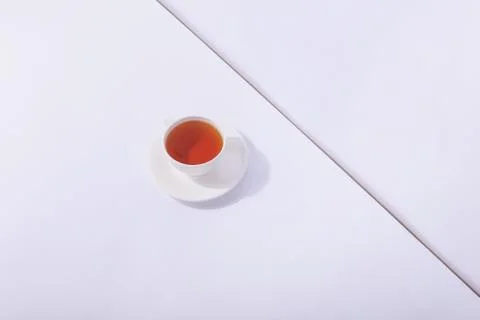 Ceramic cup with tea, on a white background. The harsh shade of the sun, the  Stock Photos