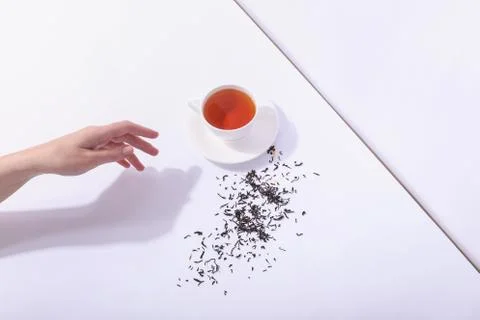 Ceramic cup with tea, on a white background. The harsh shade of the sun, the  Stock Photos