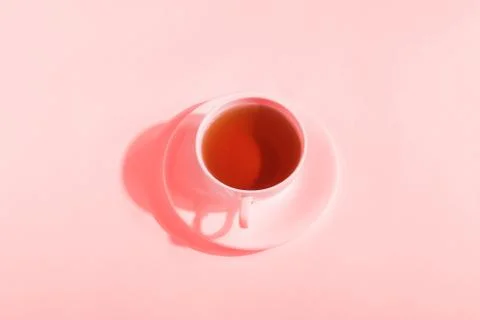 Ceramic cup with tea, on a white background. The harsh shade of the sun, the  Stock Photos