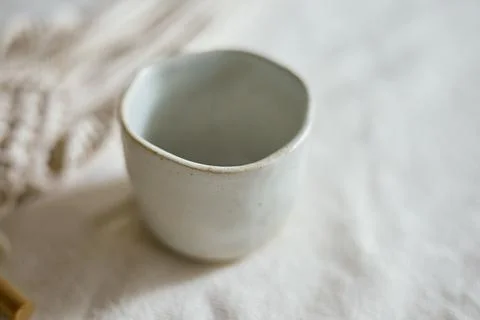 Ceramic cup on a textile Stock Photos