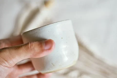 Ceramic cup on a textile Stock Photos