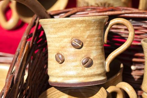 Ceramic cups in a basket at the fair Stock Photos