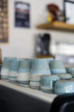 Ceramic cups on a coffee machine Stock Photos