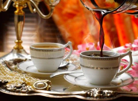 Ceramic cups of steaming hot coffee Stock Photos