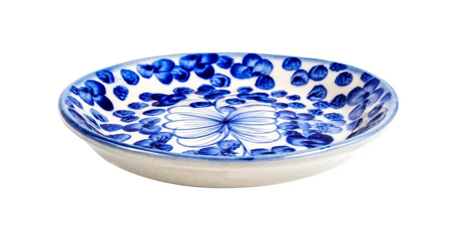 Ceramic dish with blue patterns isolated on white Stock Photos