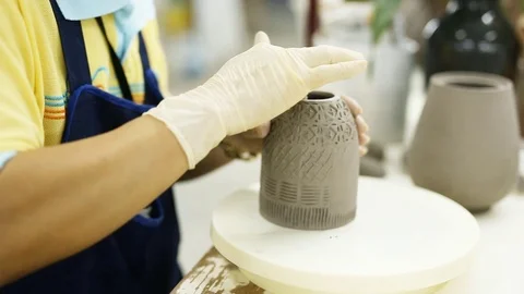 Ceramic dishes in working process Stock Footage 76506778