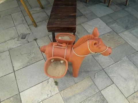 Ceramic donkey at the floor on Flat Resort, Pernambuco, Brazil. Stock Photos