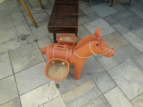 Ceramic donkey at the floor on Flat Resort, Pernambuco, Brazil. Stock Photos