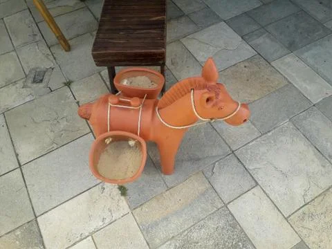 Ceramic donkey at the floor on Flat Resort, Pernambuco, Brazil. Stock Photos