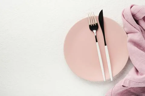 Ceramic empty pink plate. Rustic vintage set of white plate, wooden spoon on  Stock Photos