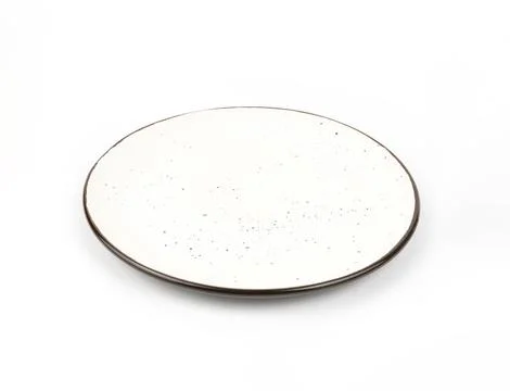 Ceramic empty plate with dark dots and brown edging on a white background. White Stock Photos
