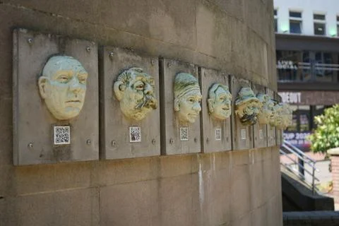 Ceramic Faces With Qr Codes On A Wall, Public Art Installation, Derby, England Stock Photos