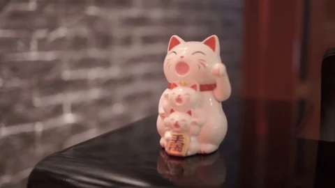 Ceramic figurine of an animal is on the table Stock Footage 77022798